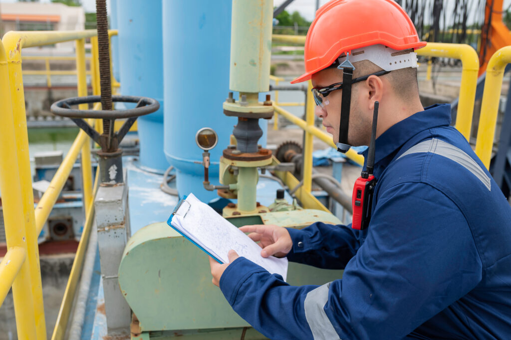 
Water plant maintenance technicians, mechanical engineers check the control system at the water treatment plant.